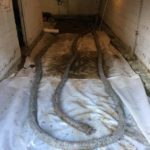 uitbraak garagevloer plaatsen drainage heraanleg vloer in gepolierd beton - Massaert bvba
